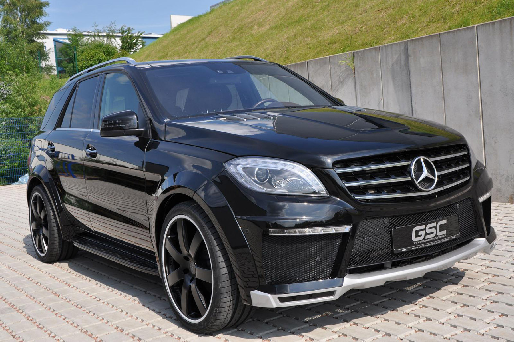 A mercedes benz w169 with lowered suspesion and a widebody kit on